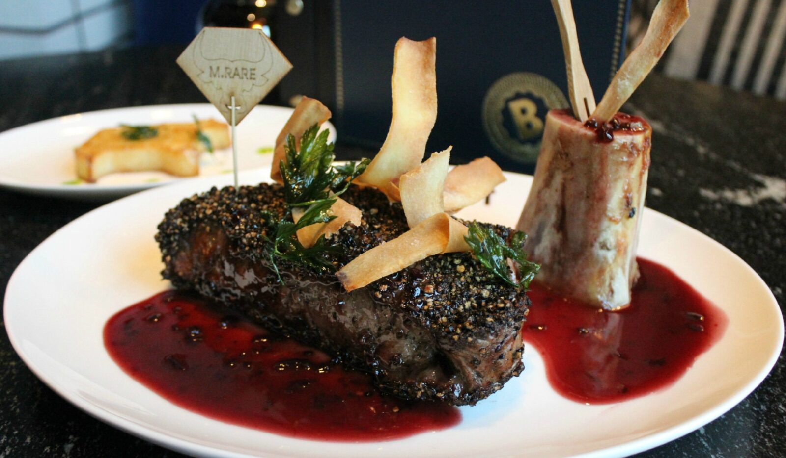 Steak au poivre with roasted bone filled with marrow